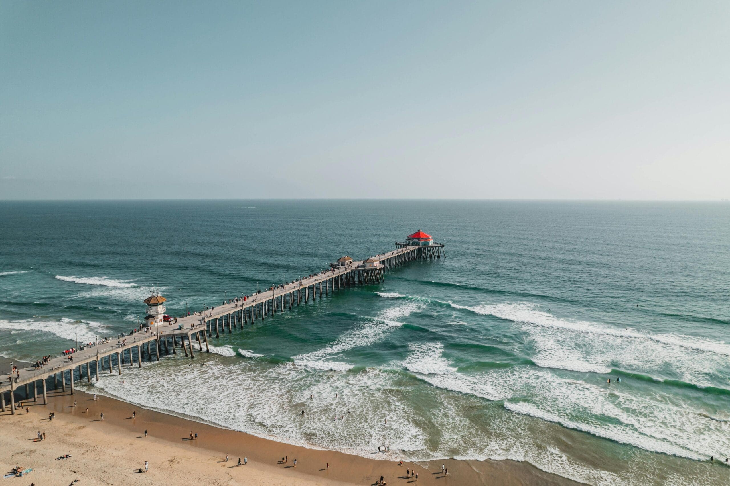 Sunset at Huntington Beach: Golden sand, perfect surfing waves, and the iconic HB pier. Experience Southern California's laid-back coastal lifestyle.