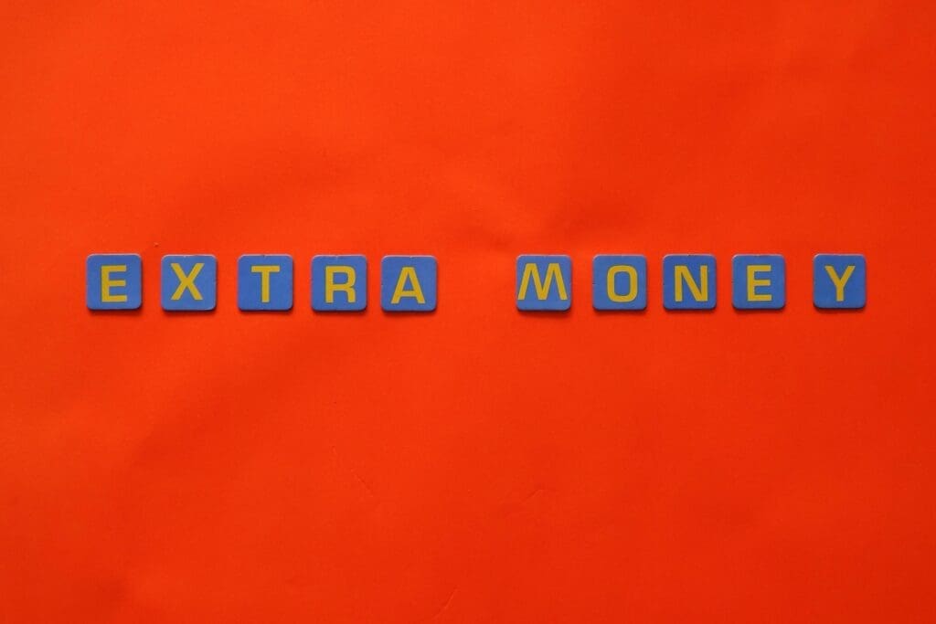 an orange background with the words extra money